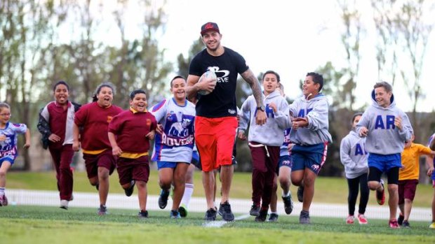 Injured Raiders player Blake Ferguson at Erskineville Oval with under 10 players for the Alexandria Rovers on Thursday.