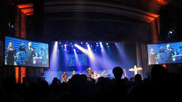 Full house: Hillsong pastor Brian Houston on stage during a service at the Manhattan Centre Grand Ballroom in New York City. The services are part worship-part concert and draw a predominantly young crowd with Christian rock bands and a nightclub vibe.