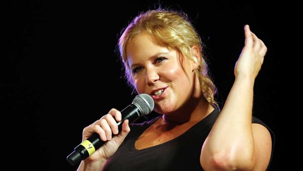 Amy Schumer performs on stage at 'Comedy Central's Stars Under the Stars' at Central Park SummerStage on June 26, 2013 in New York City.