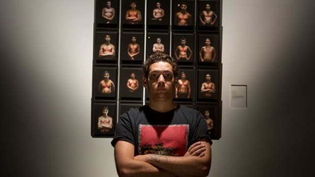 Sydney-based artist Tony Albert with We Can Be Heroes 2013-14, winner of last year's National Aboriginal and Torres Strait Islander Art Award.