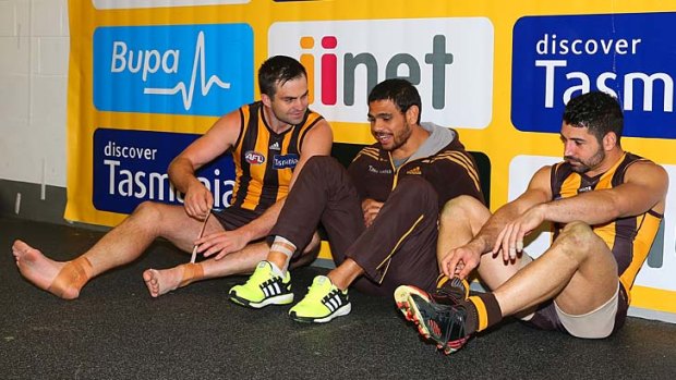 Brian Lake, Cyril Rioli and Brent Guerra after the qualifying final win over Sydney.
