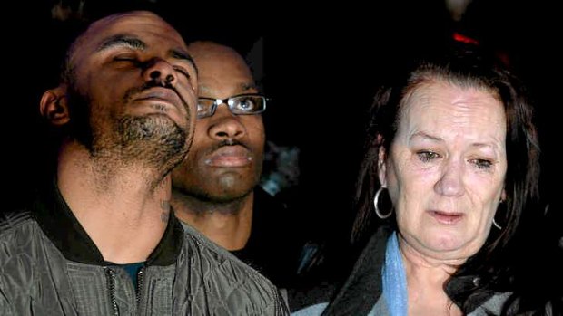 Pam Duggan (right), and Marlon Duggan (left), Mark Duggan's mother and brother, react after the verdict.