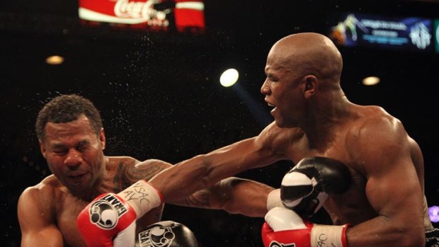 Floyd Mayweather Jr (right) lands a punch during his comfortable decision victory over Shane Mosley in May 2010.