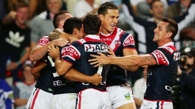 First touch: Sonny Bill Williams (centre) celebrates with teammates after his sublime cut-out pass to Roger Tuivasa-Sheck set up the Chooks' opening try on Friday.