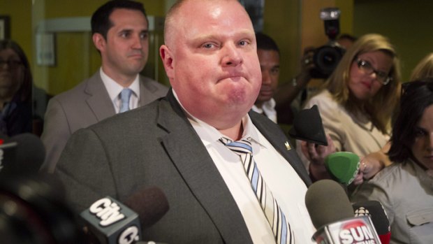 Toronto Mayor Rob Ford makes a statement to the media after the resignation of his communications aides George Christopoulos and Isaac Ransom.