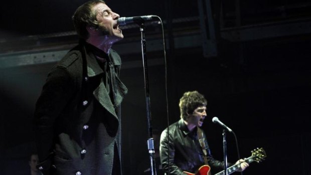 Liam and Noel Gallagher on stage together just before Oasis split in 2009.