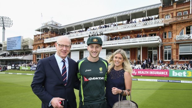 Australia debutant Peter Nevill is congratulated by his father, Peter, and fiancee, Sam Nelson, after receiving his baggy green cap before day one of the second Test against England in London.