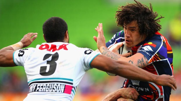 On the move: Melbourne Storm's Kevin Proctor tries to evade a tackle in yesterday's clash with Penrith.