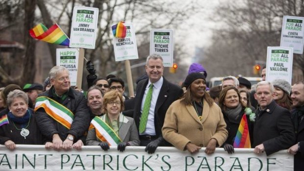 New York mayor Bill de Blasio, centre, had threatened to boycott next year's St Patrick's Day parade unless gay groups could march.