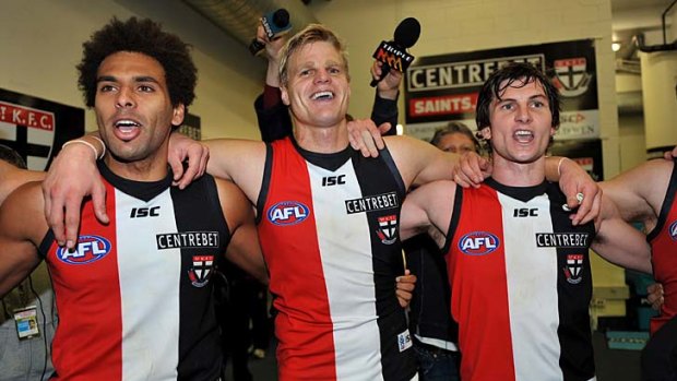 Captain Nick Riewoldt and his teammates are jubilant after the Saints' win over North Melbourne last night.