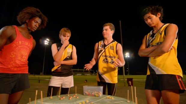 Three's a crowd: Tactics change in a conceptual artwork by Gabrielle de Vietri that creates a round AFL pitch and three teams.