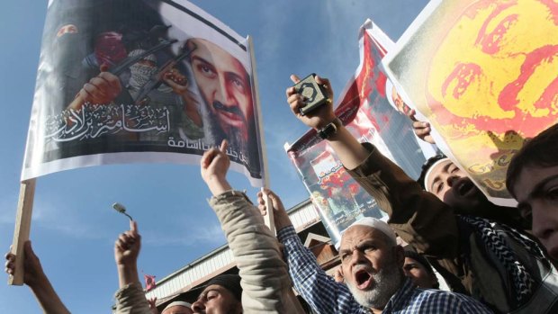 Backlash .... Palestinian Muslims protest with images of Osama Bin Laden in Gaza.