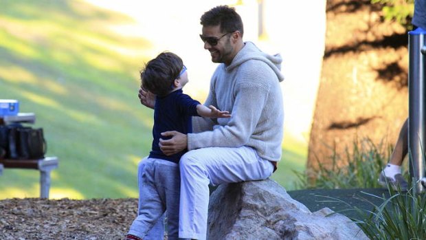 Solid as a rock: Ricky Martin with son Valentino at Bronte Beach.