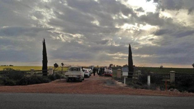 Police at the scene of the murder of three children and a woman near Wagga. 