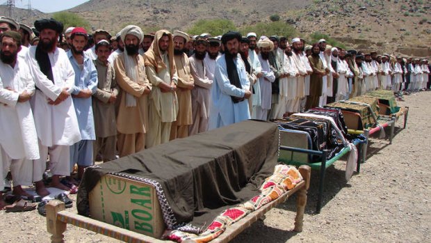 The price: Villagers mourn their dead after a drone attack in Miranshah, North Waziristan.