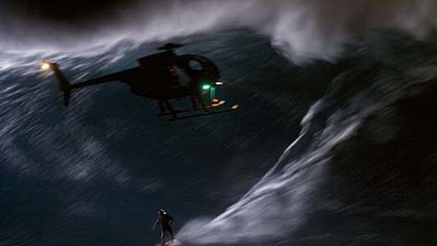 A chopper films Mark in action at night.