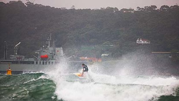Life's not always a beach  ... These shots of surfing in Sydney Harbour this morning were taken by Eugene Tan of <a href ="http://www.aquabumps.com">www.aquabumps.com</a>