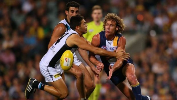 Matt Priddis of the Eagles handballs during the round five AFL match between the West Coast Eagles and the Port Power at Patersons Stadium on April 19.