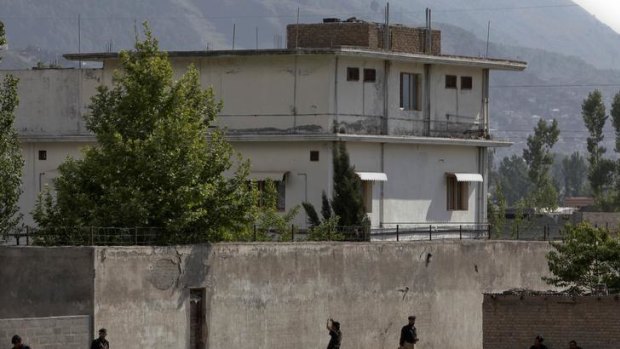 Members of Pakistan's anti-terrorism squad are seen surrounding the compound two days after al-Qaeda leader Osama bin Laden was killed in Abbottabad.