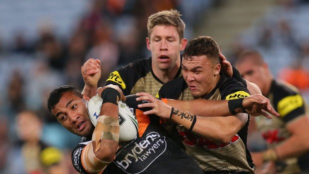 Ava Seumanufagai of the Tigers is tackled during the round 17 NRL match between the Wests Tigers and the Penrith Panthers.