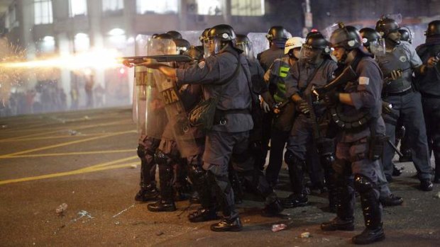 Police fire rubber bullets at people protesting the increase in the price of public transportation in Sao Paulo, Brazil.