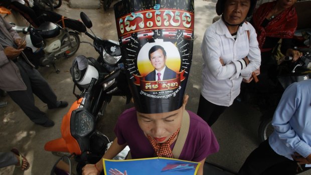 A supporter of the opposition Cambodia National Rescue Party protests in support of jailed party president Kem Sokha.