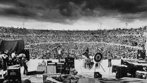 Rain song: Led Zeppelin play Kooyong Stadium in 1972 as a storm brews.