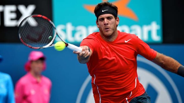 Juan Martin del Potro stretches for a forehand against Bernard Tomic.