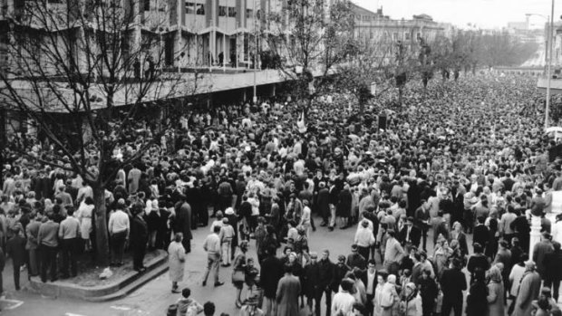 Crowds hoping to see the Beatles outside their Melbourne hotel in 1964.