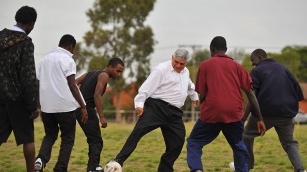 James Demetriou, who runs the not-for-profit charity Sports Without Borders, plays soccer with a team of young African refugees. 