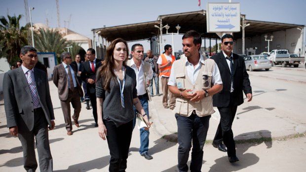 Border patrol ... Angelina Jolie inspects conditions on the Libyan/Tunisian border.