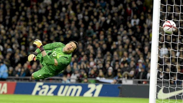 Brazil's goalkeeper Julio Cesar fails to save Lampard's shot.