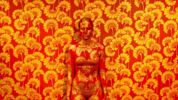 Portrait of model, Tarryn Lambert painted by Body Artist, Emma Hack, against a Florence Broadhurst wallpaper design.