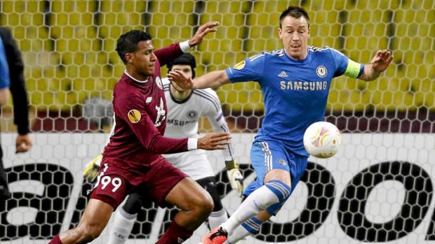 John Terry vies for the ball with Rubin Kazan's Jose Rondon. Chelsea is the only English club left in European competition.