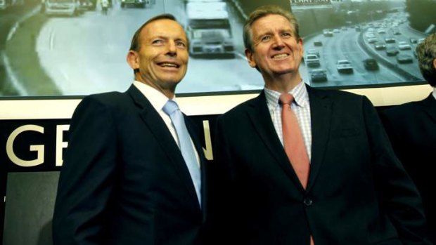 NSW Premier Barry O'Farrell, right, with Prime Minister Tony Abbott earlier this month. Mr O'Farrell has criticised Senator George Brandis over comments about bigots.