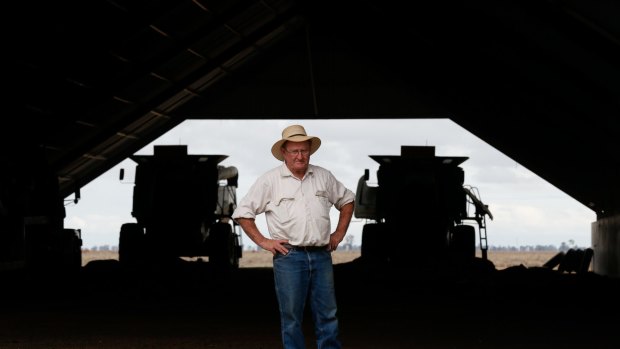 Farmer Michael O'Brien with harvesters he has not used for years because of the drought.