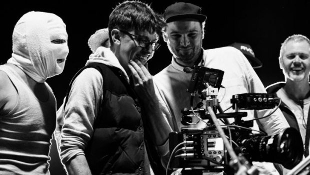 On set ... director Abe Forsythe (second from left) watches a take with actor Justin Rosniak, director of photographry Lachlan Milne and stunt co-ordinator Tony Lynch.