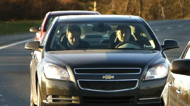 General Motors CEO Rick Wagoner travels as a passenger in a car from Detroit to Washington.