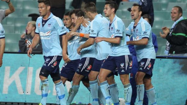 Italian job: Sydney players celebrate with Del Piero after his first-half strike.