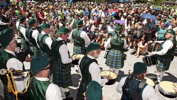 The Queensland Irish Association Pipe Band plays at the Irish Fair in King George Square.