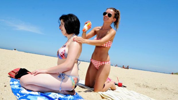 Dragana Przulj (left) and Ena Colo, at Middle Park Beach, are among the majority of young girls who risk all for a tan.
