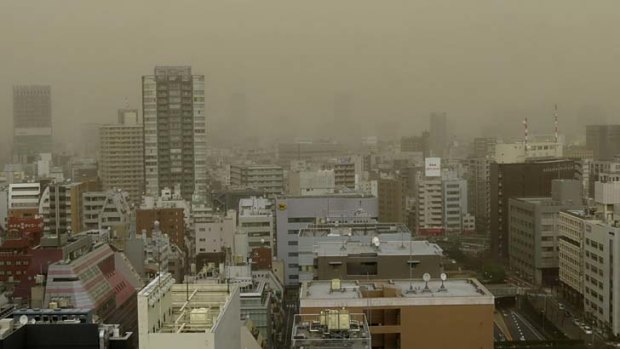 Dust storm ... Tokyo's shopping district Ginza covered in brown dust.