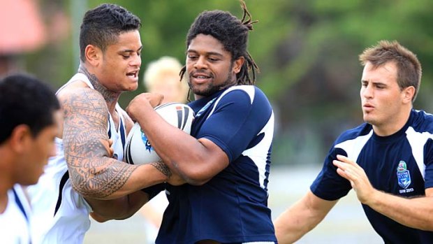 Settled &#8230; Jamal Idris, centre, training with the Emerging Blues squad at Redfern Oval on Saturday, said he was happy to play anywhere on the field for the Titans.