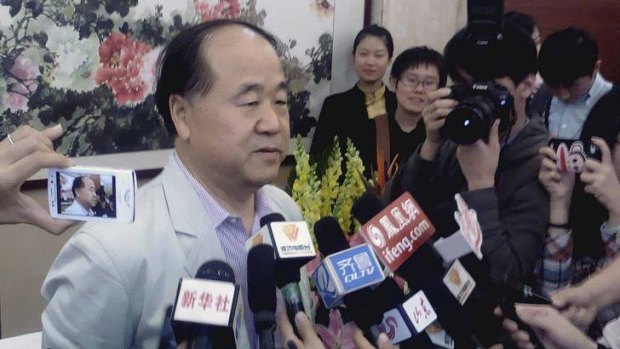 Official winner ... Mo Yan talks to the media in his hometown of Gaomi, Shandong province, after the Nobel announcement.