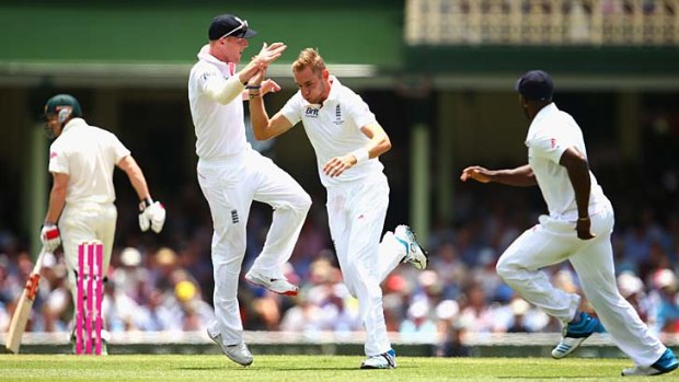 Stuart Broad celebrates after taking the wicket of George Bailey.