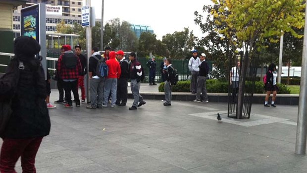 Brandon Faananu Siaa's friends gather outside the train station.