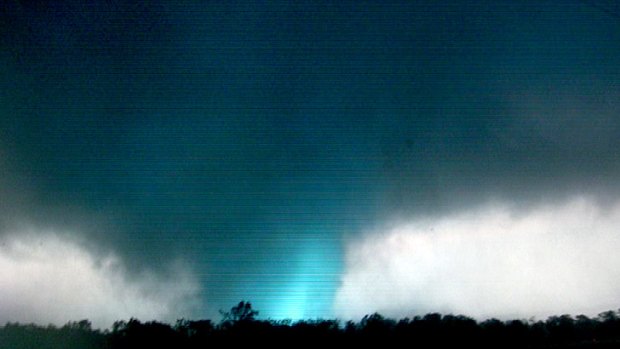Amateur video captures lightning striking inside the twister as it bears down on Joplin, Missouri. Photo: AP/tornadovideo.net