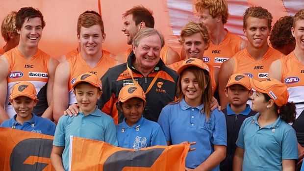 Mixing it up: Kevin Sheedy with local school children during a GWS Giants media session at Sydney Olympic Park Sports Centre on May 6.