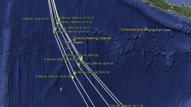 A map shows the possible paths and crash zones of Malaysia Airlines flight MH370.