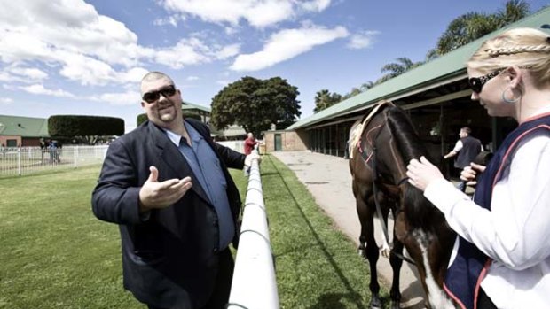 Saviour? ... Nathan Tinkler’s takeover bid for the Newcastle Knights is back on the table after both parties resumed negotiations again yesterday.  The mining magnate is pictured here with one of his beloved racehorses.